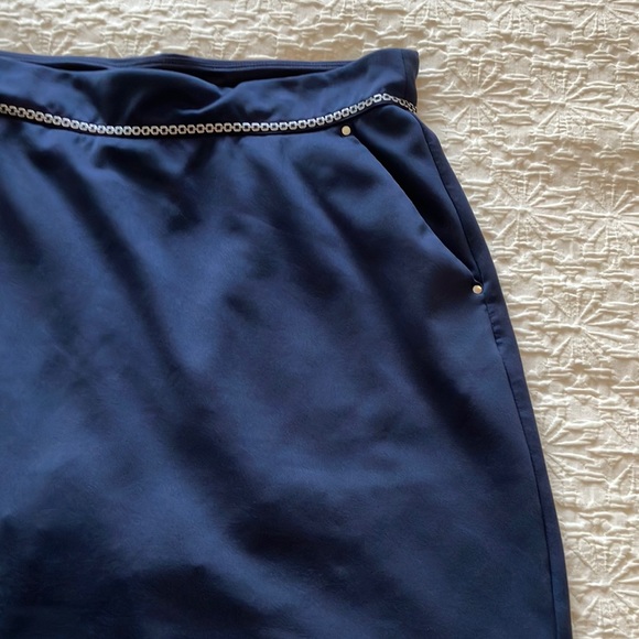 Great Greg Norman navy skort with navy and silver braid around waistband. - Picture 5 of 15